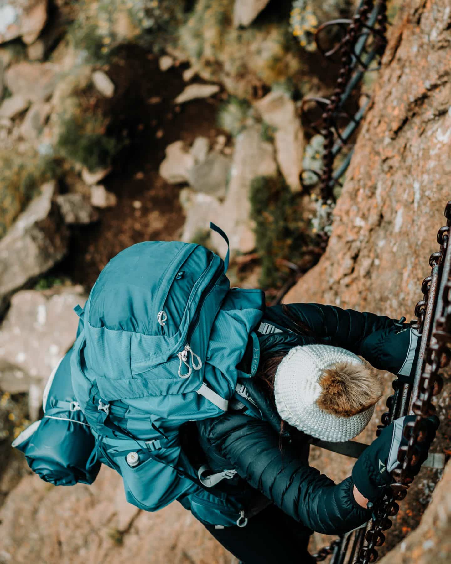 girl climbing the chain ladders at tugela falls