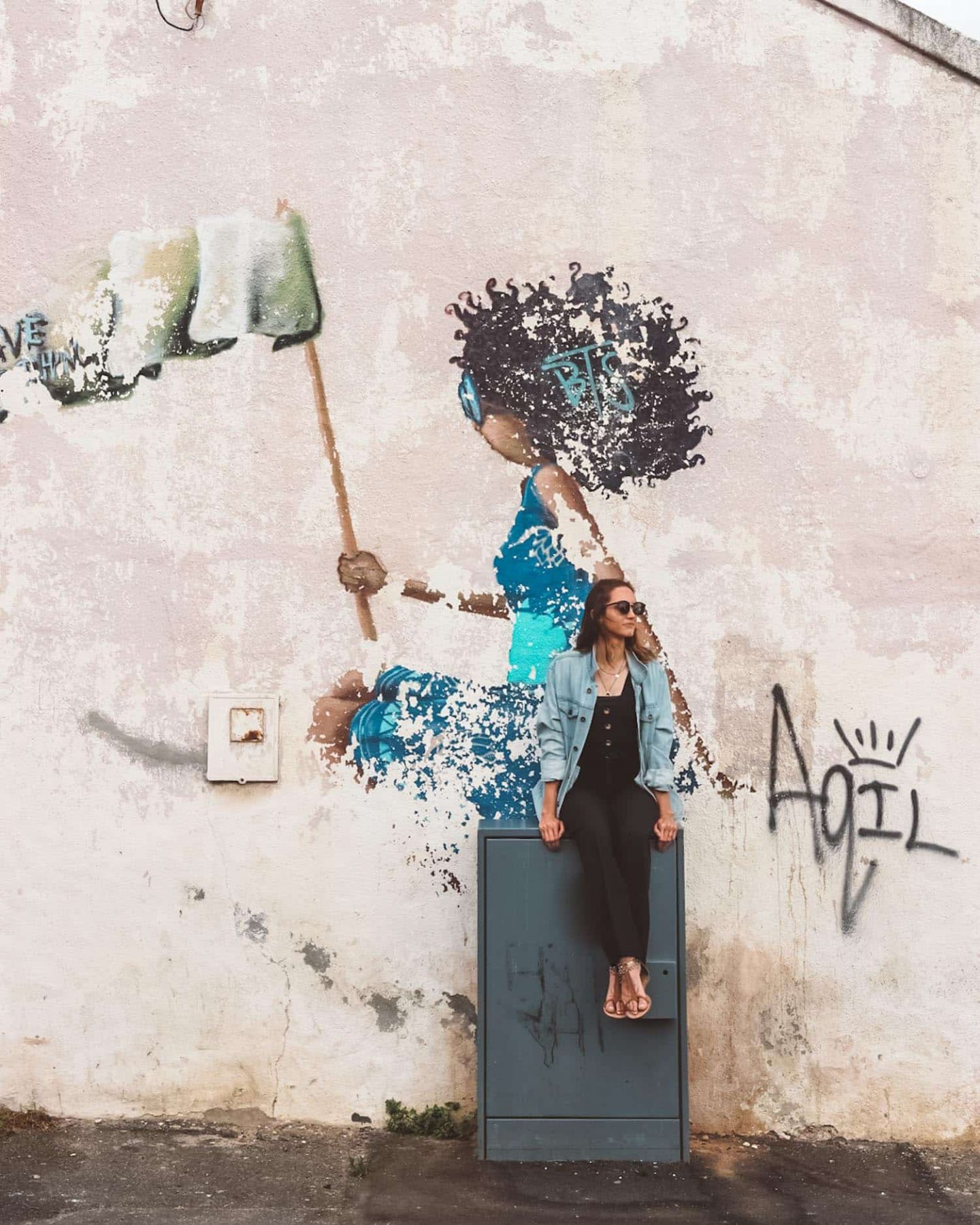 girl posing with street art in woodstock