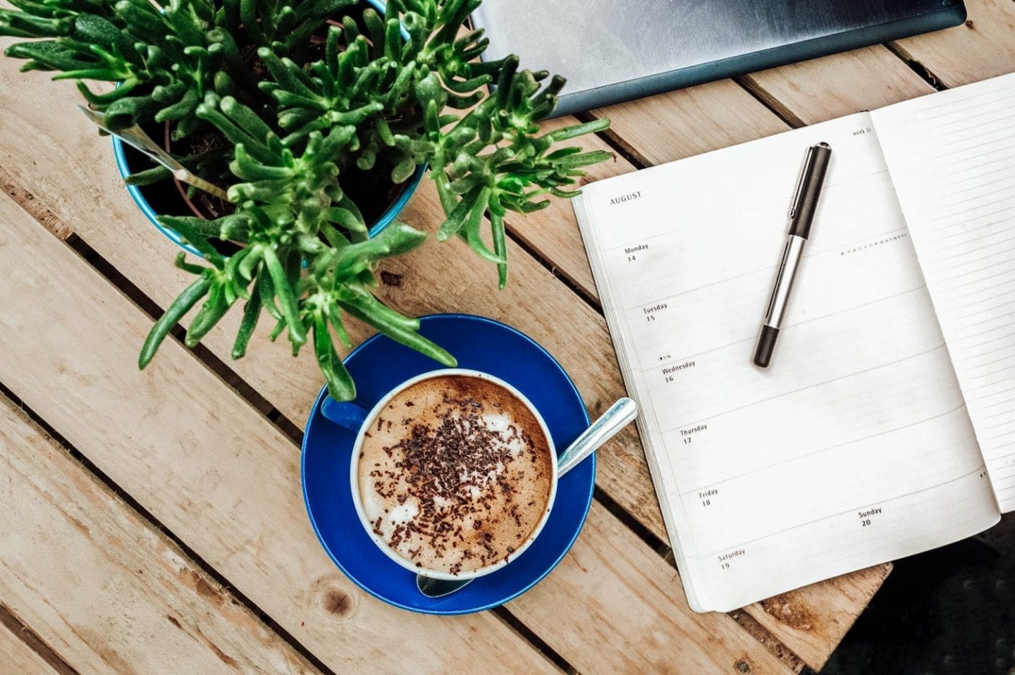 calender note book with a cup of coffee