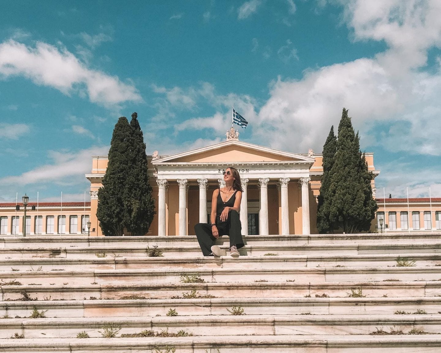 girl sitting in front of Zappeio Hall