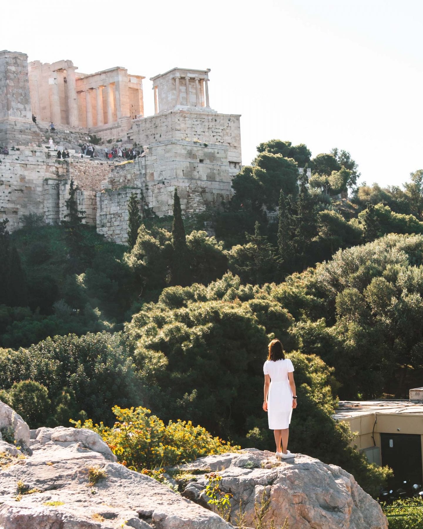 girl standing in front of the acroplis