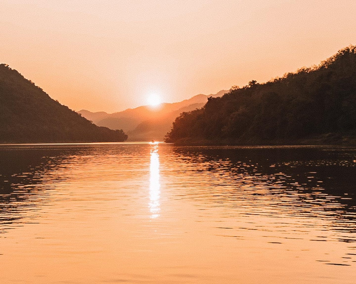 sunset cruise along the mekong