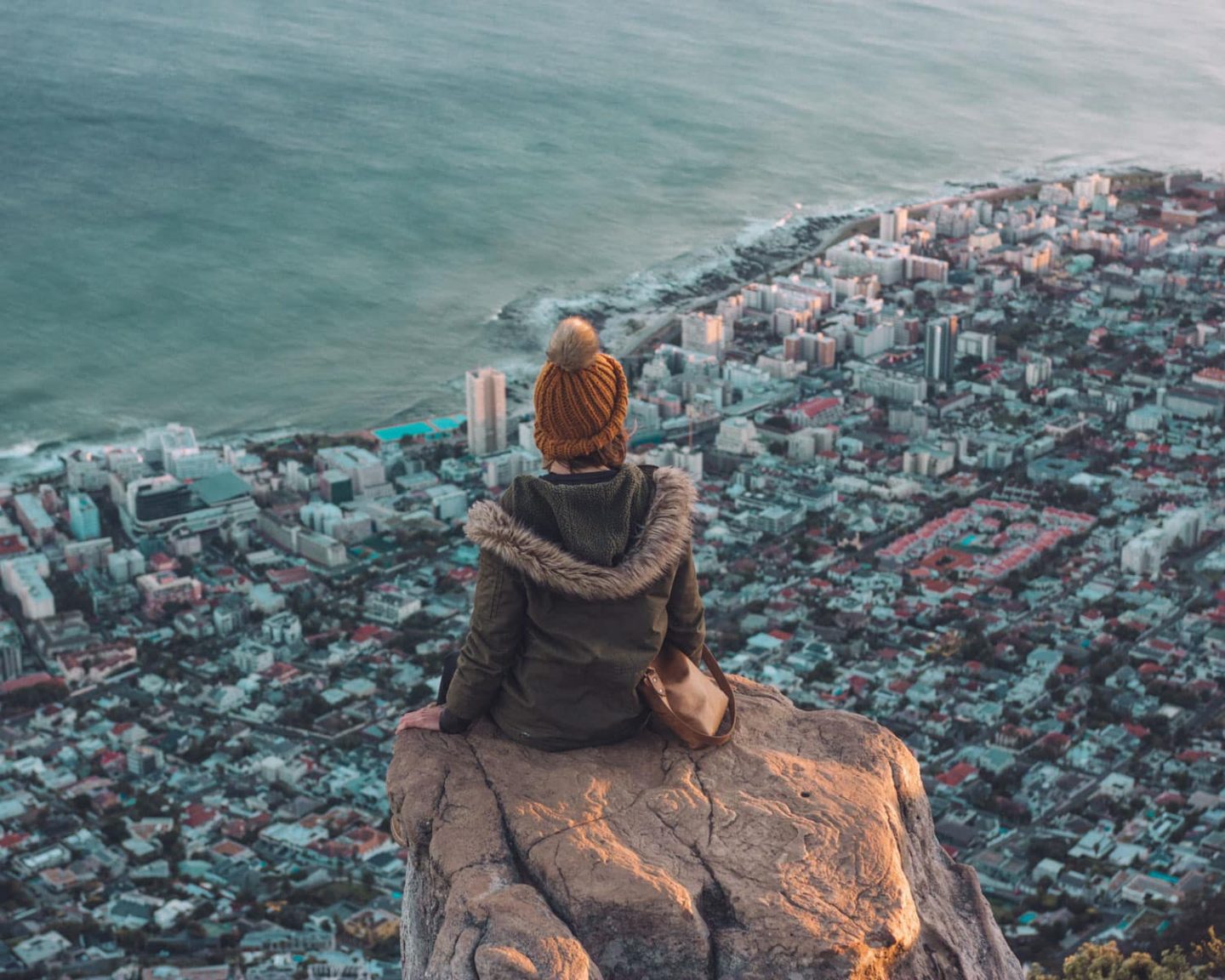 girl on top of lions head