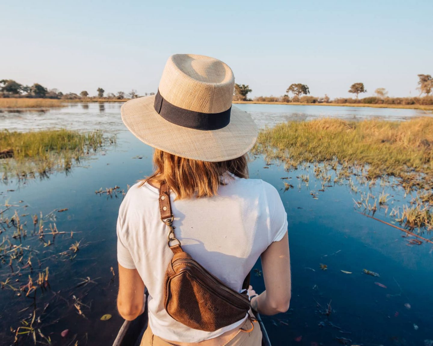 girl on mokoro safari in the okavango delta