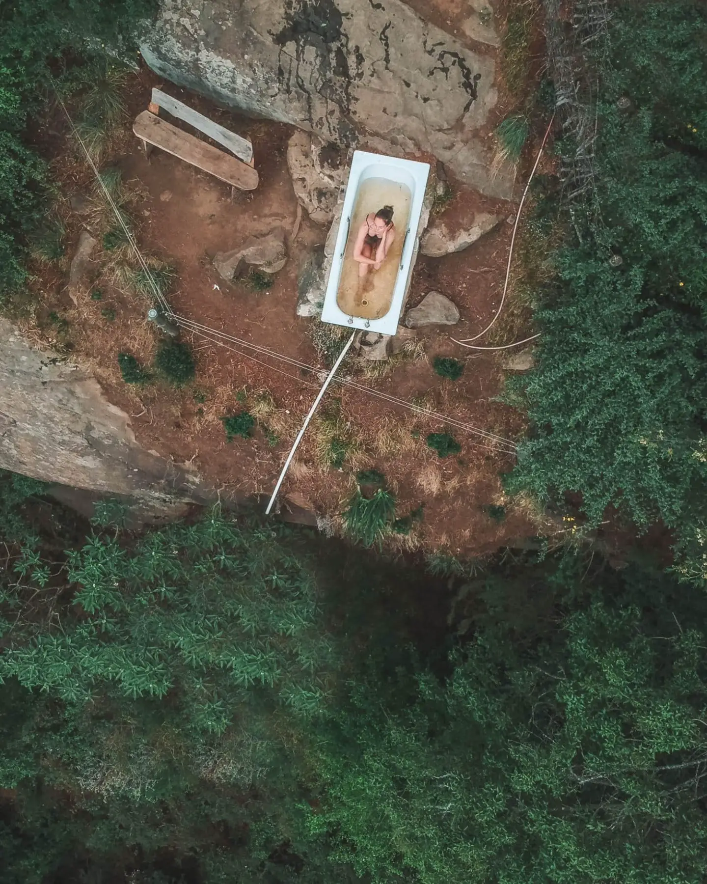 girl in bathtub in the middle of the forest