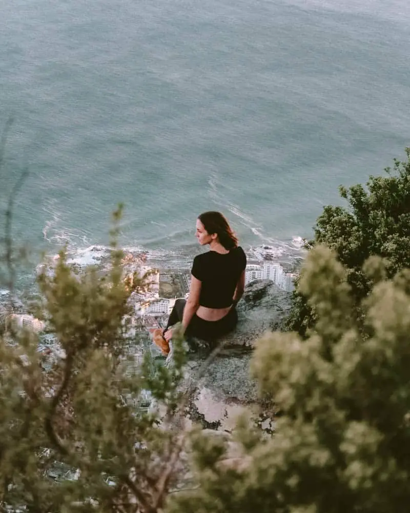 girl on top of lions head