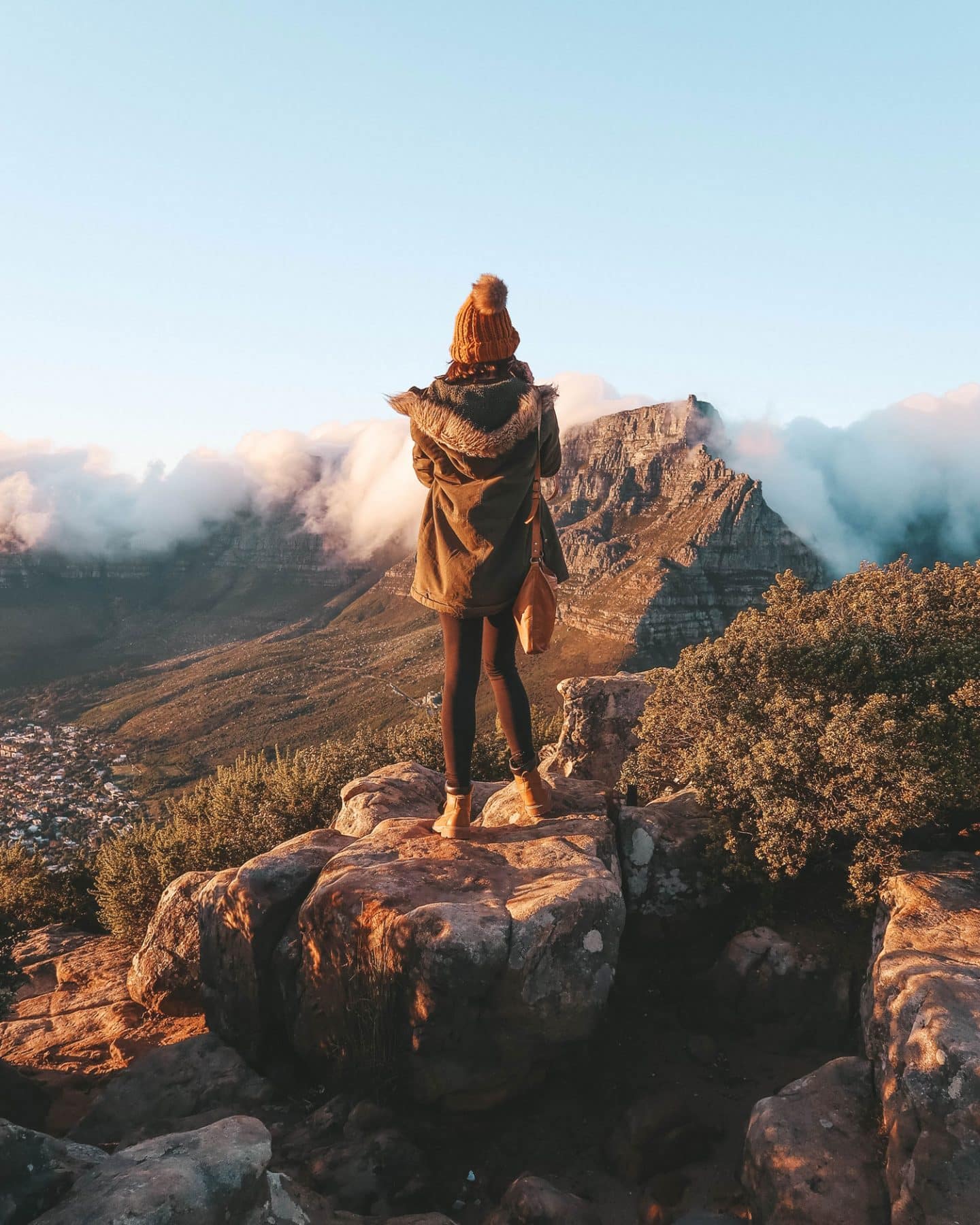 girl on top of lion's head in cape town