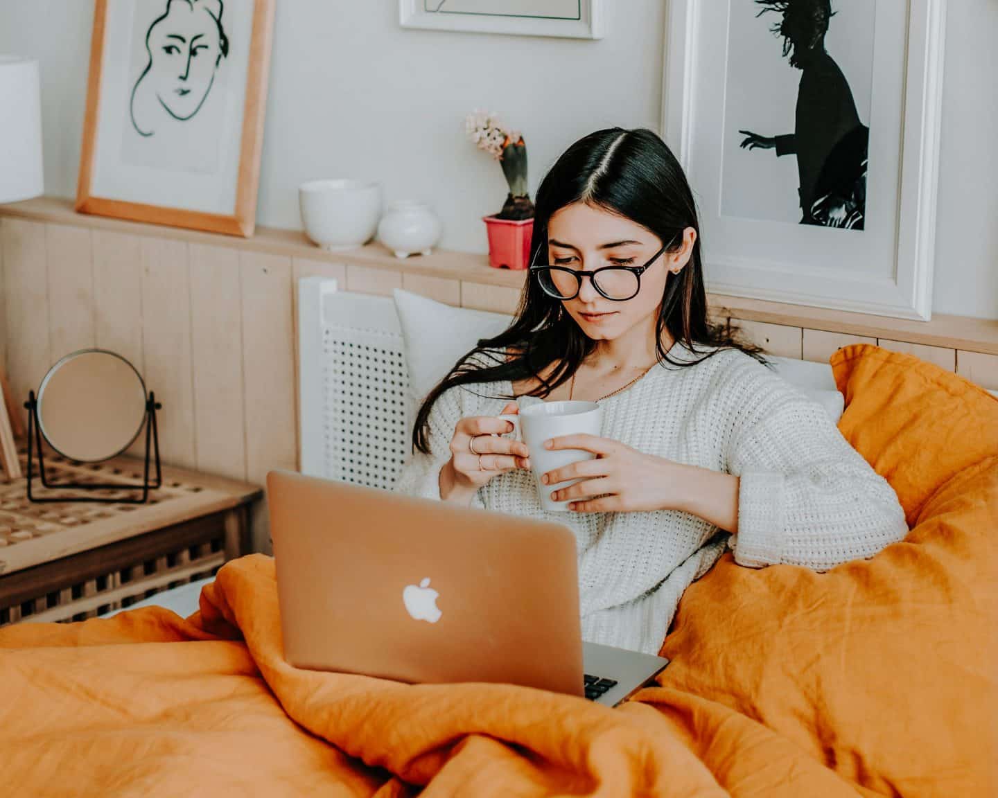 girl in bed with laptop