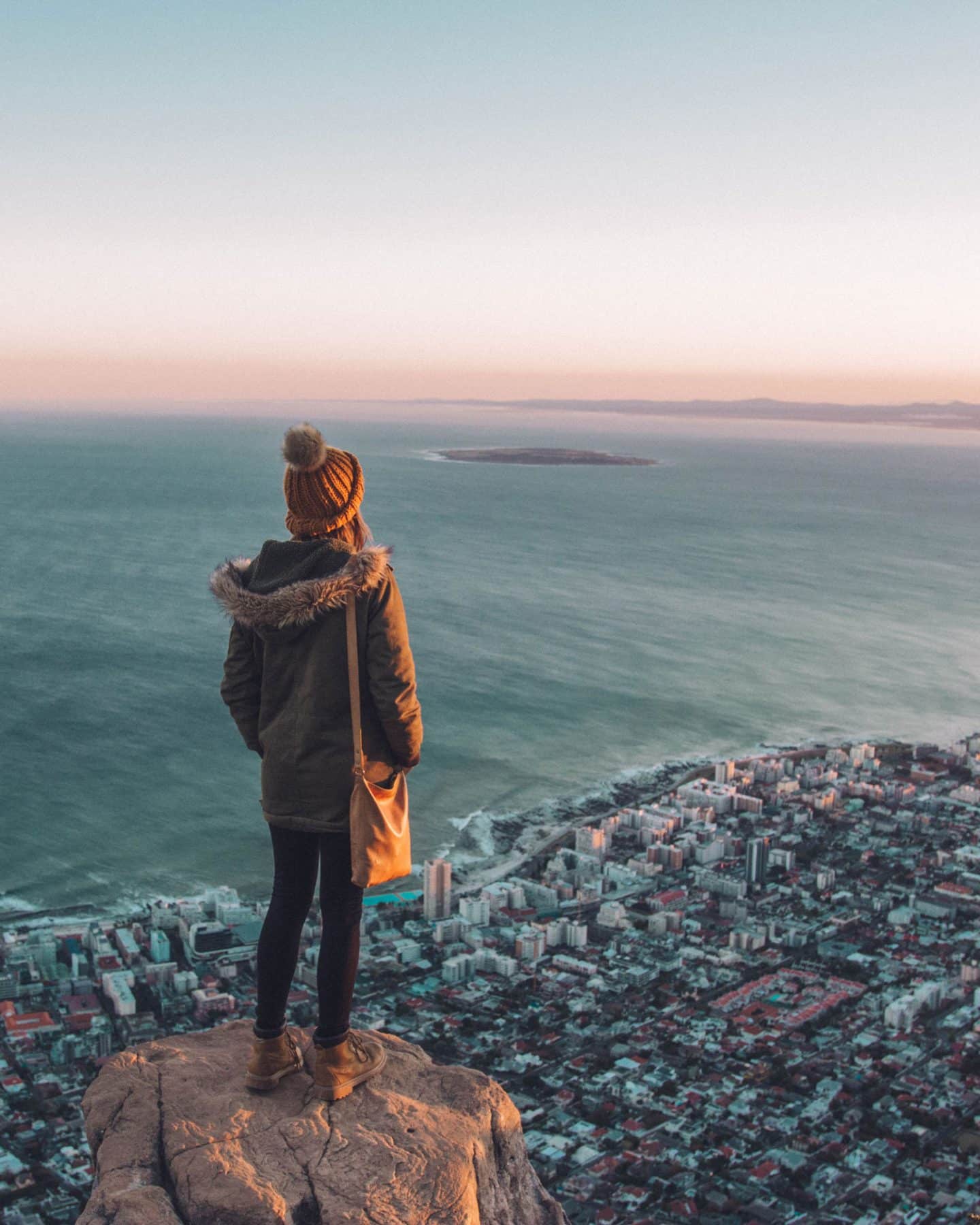girl standing on top of lion's head