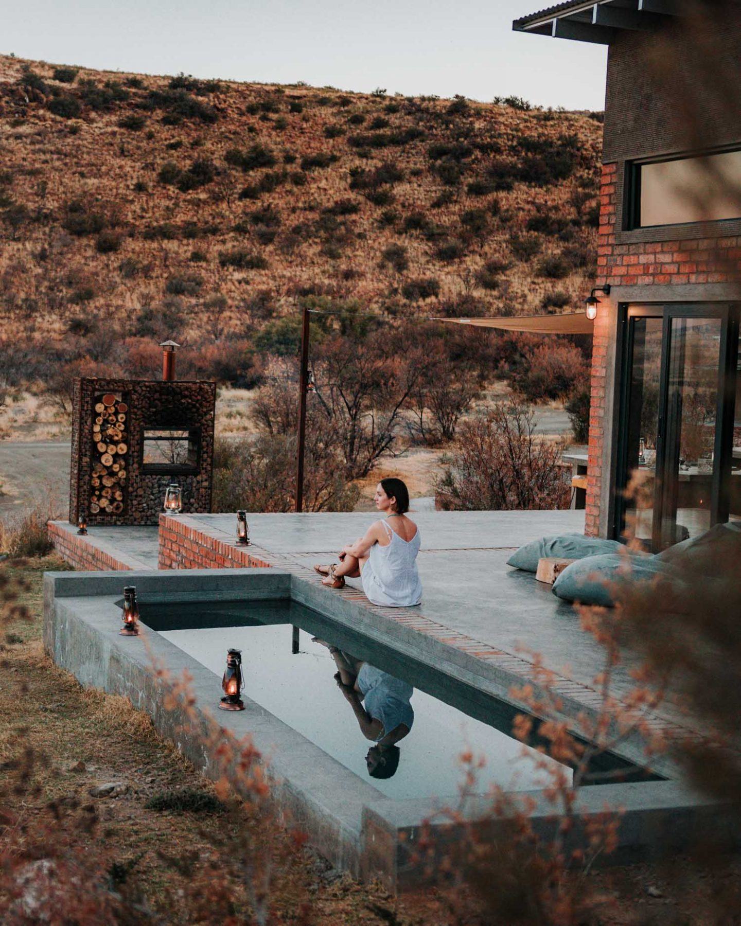 girl sitting at pool edge