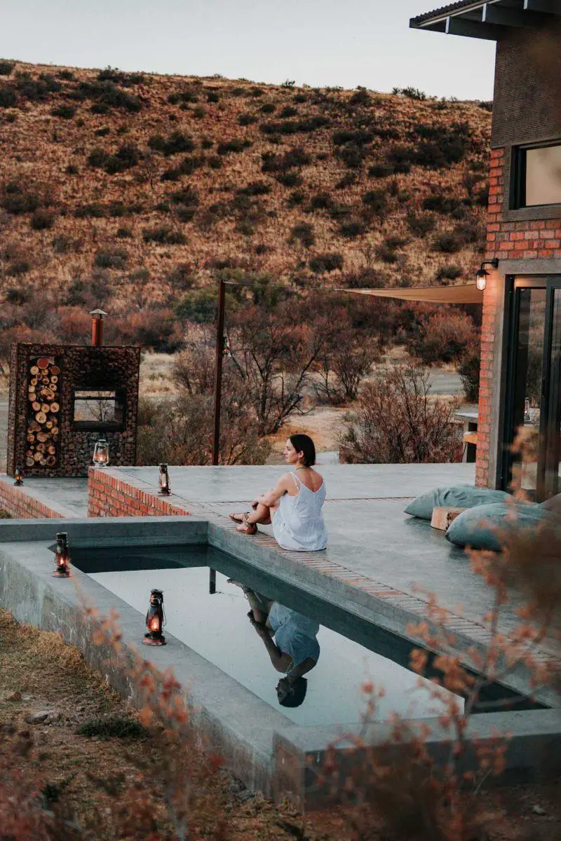 girl sitting at pool edge