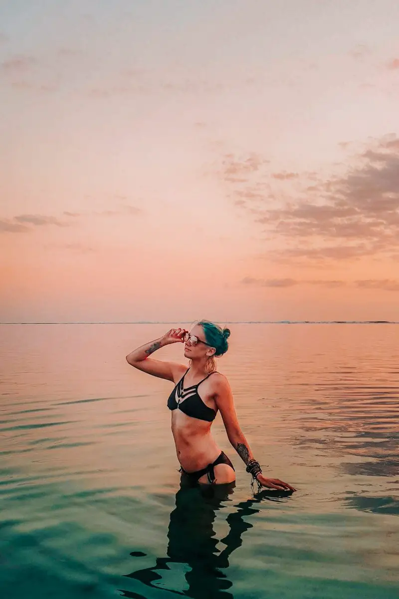 girl in reunion island on the beach at sunset