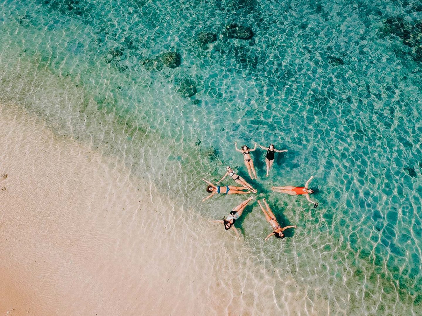 drone shot of girls on the beach at reunion island