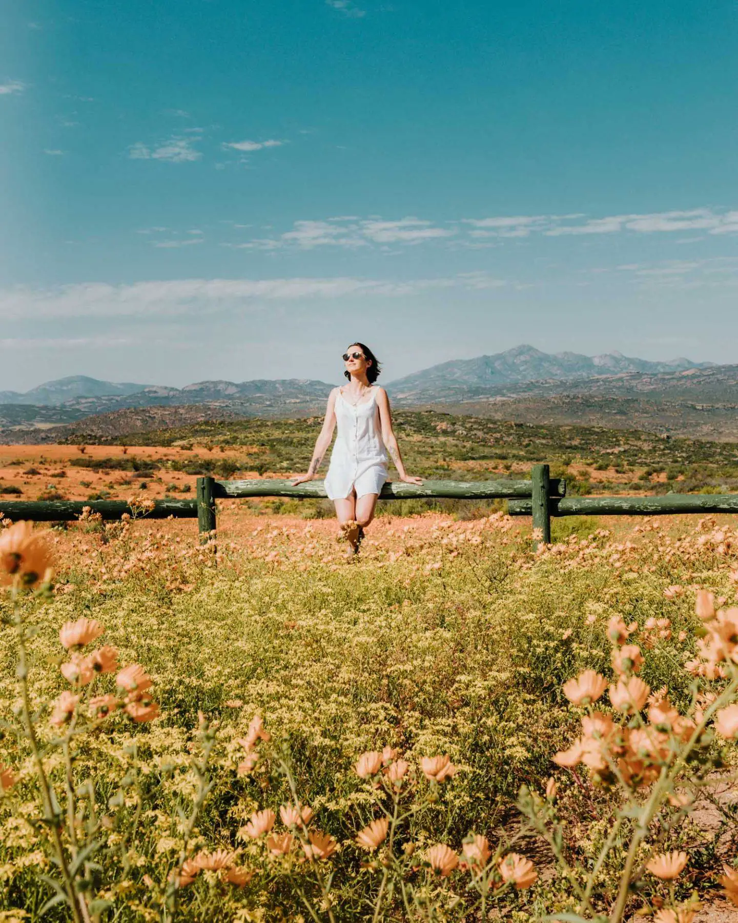 girl by wildflowers in namaqua national park
