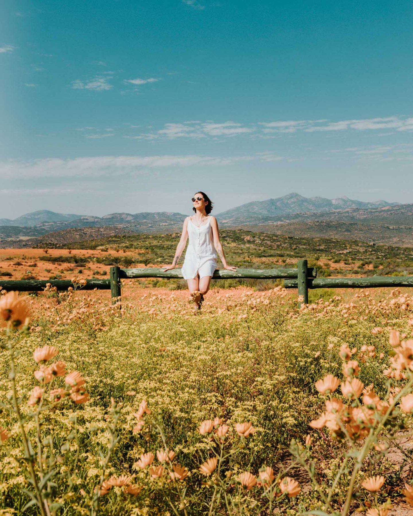 girl by wildflowers in namaqua national park