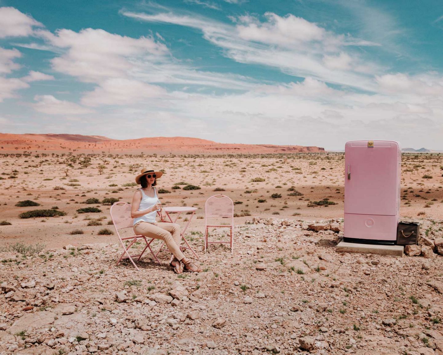 girl sitting in the desert in namibia