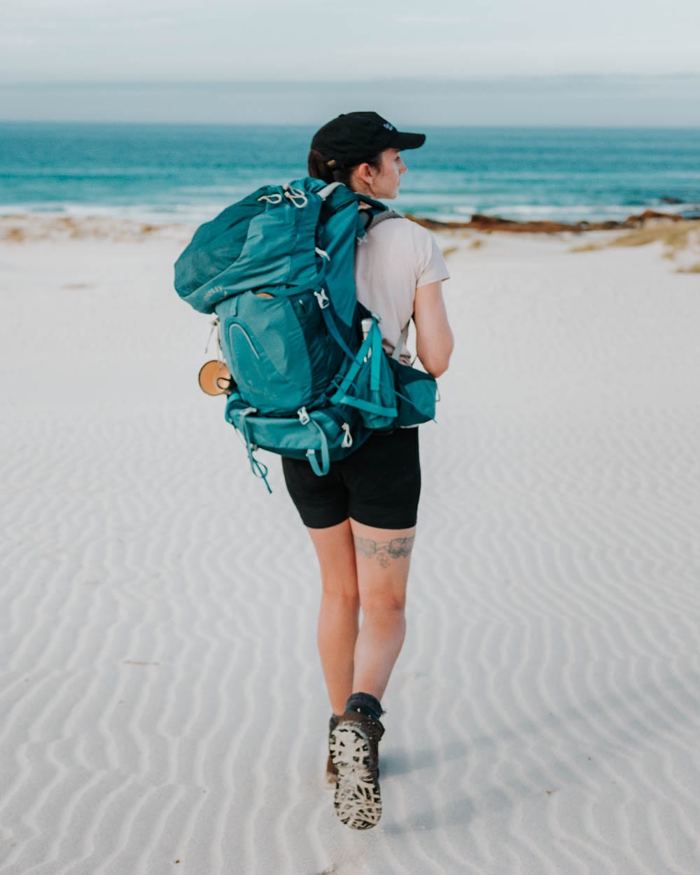 girl walking on beach in cape point