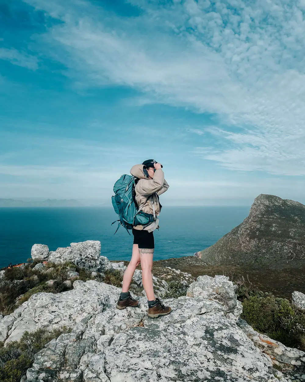 girl hiking cape of good hope trail in south africa