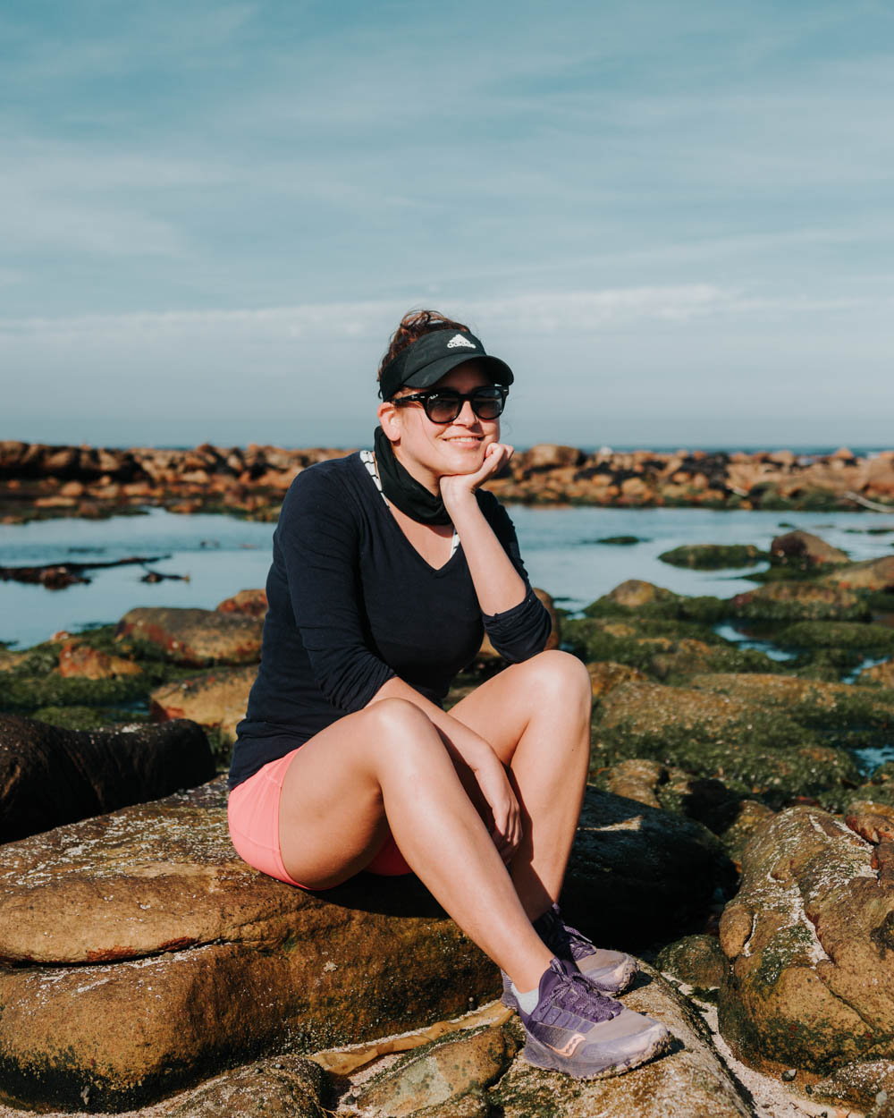 girl sitting on rock
