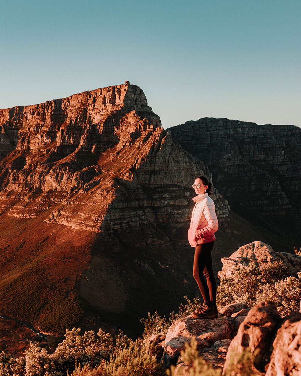 girl on top of lions head in cape town