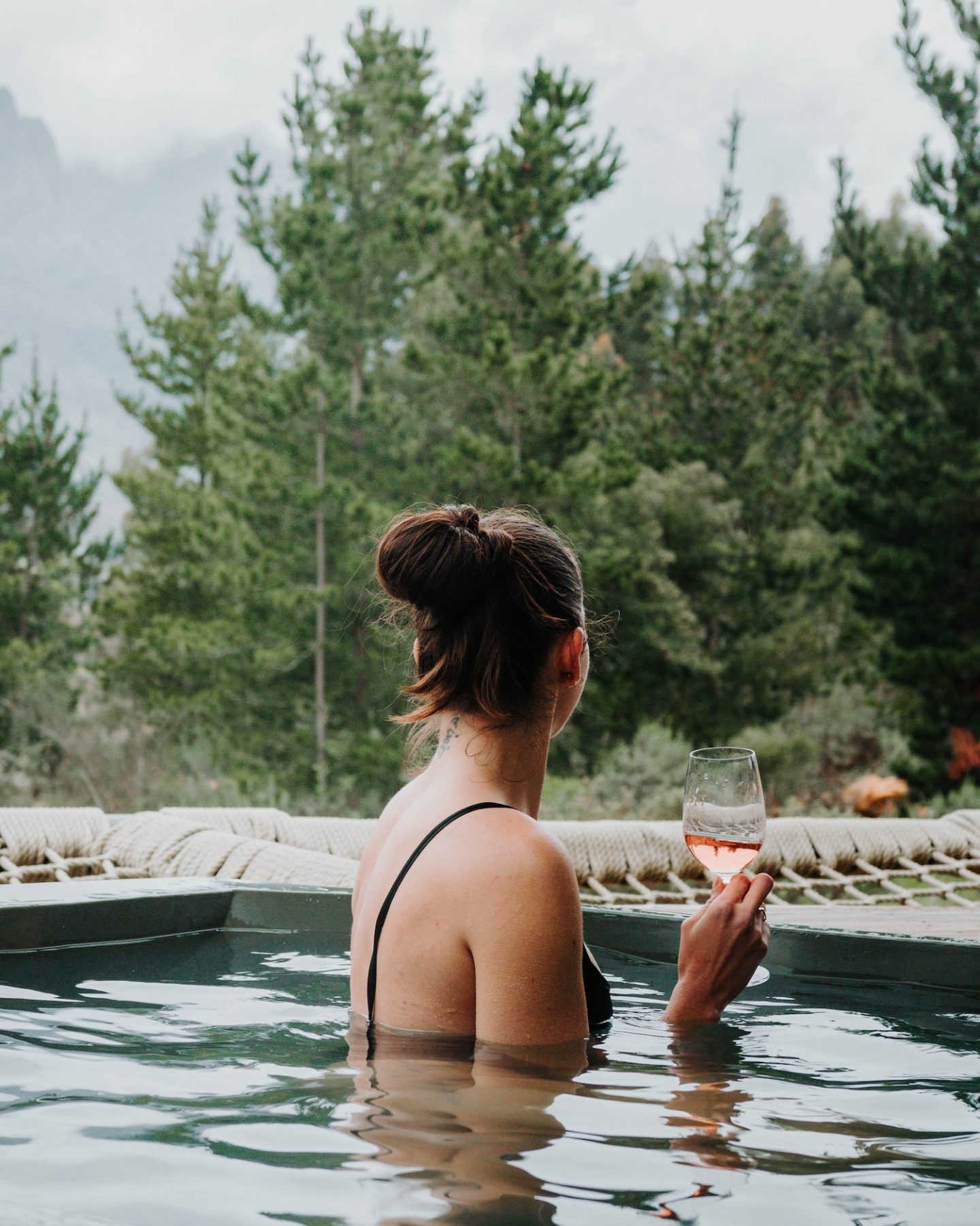 woman in hot tub at a cabin in tulbagh