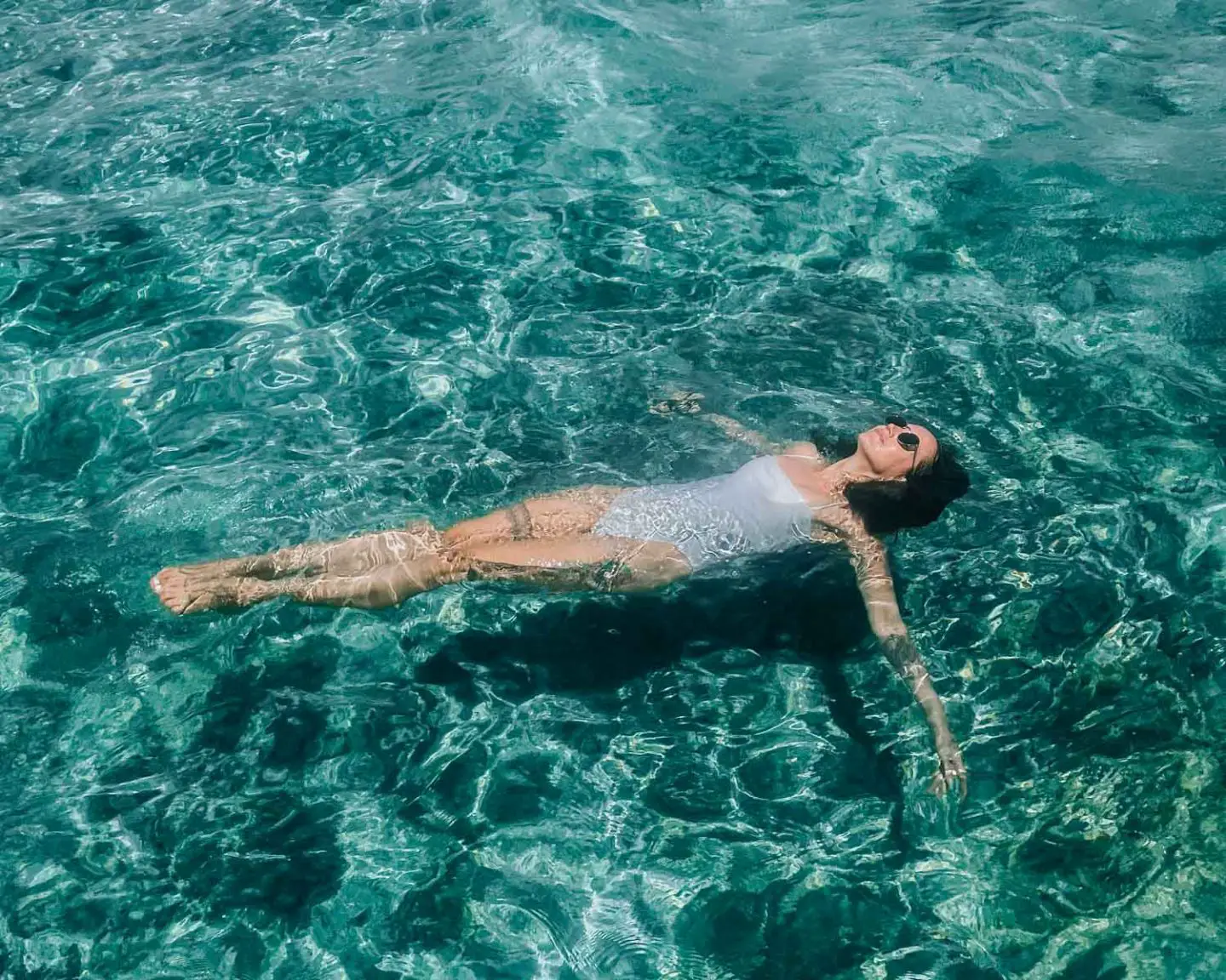 girl floating in ocean