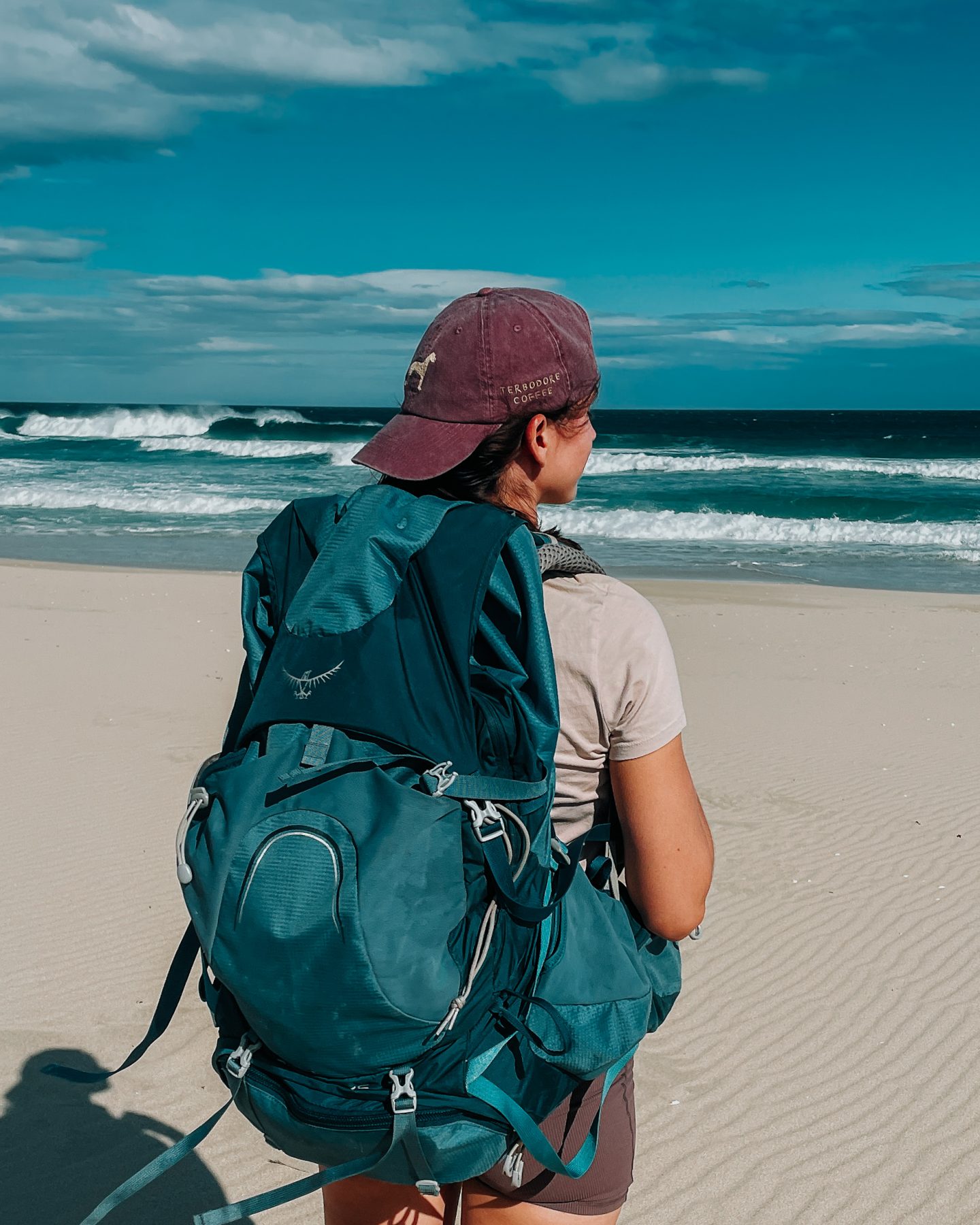 girl hiking on beach