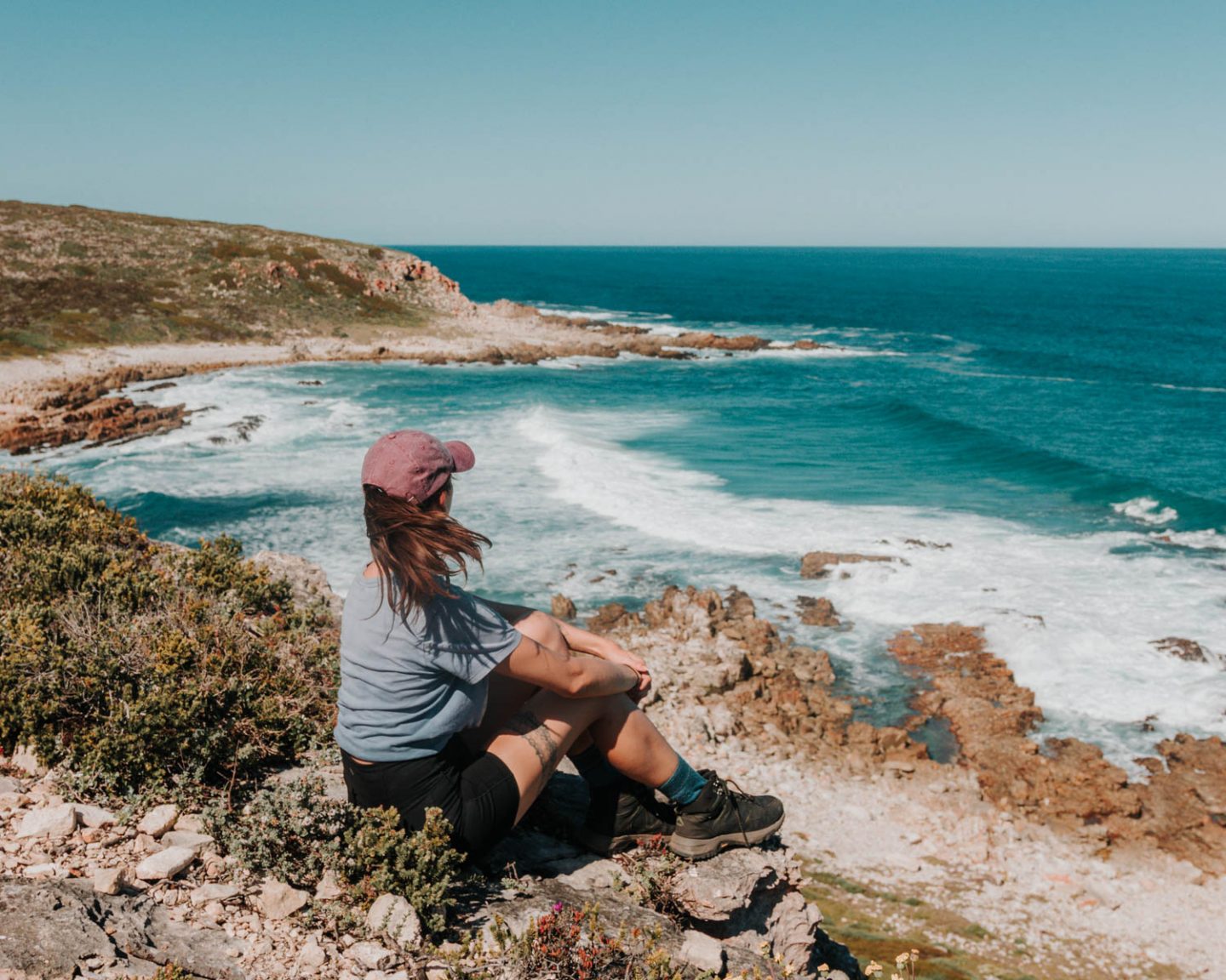 girl hiking the whale trail in south africa