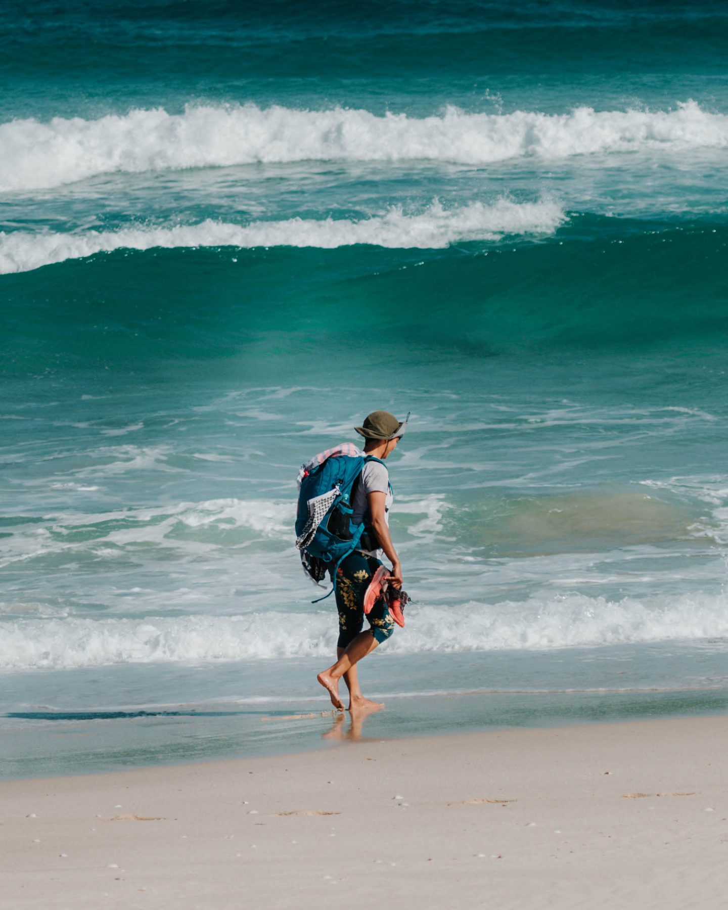 girl walking along the beach