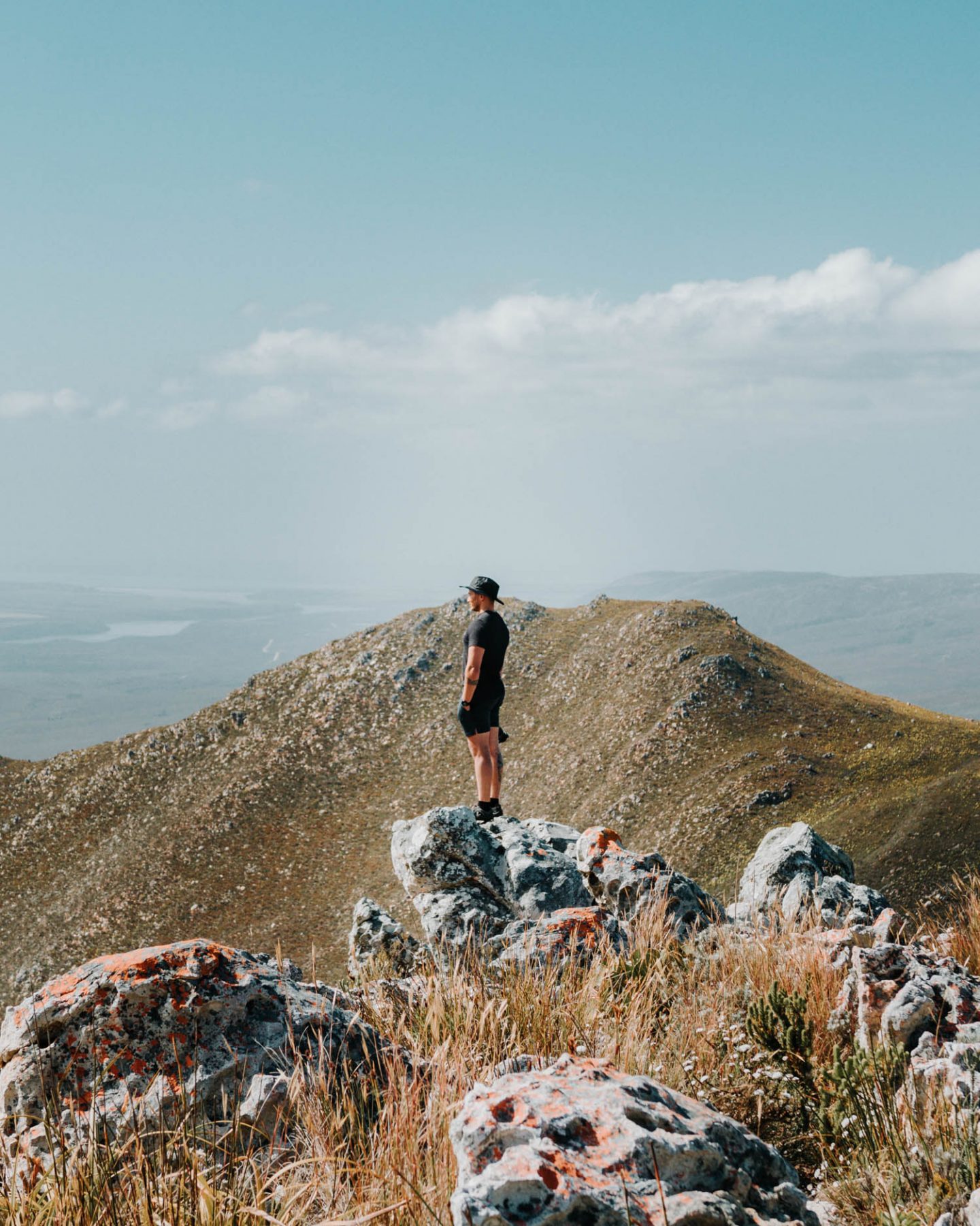 man standing on rock