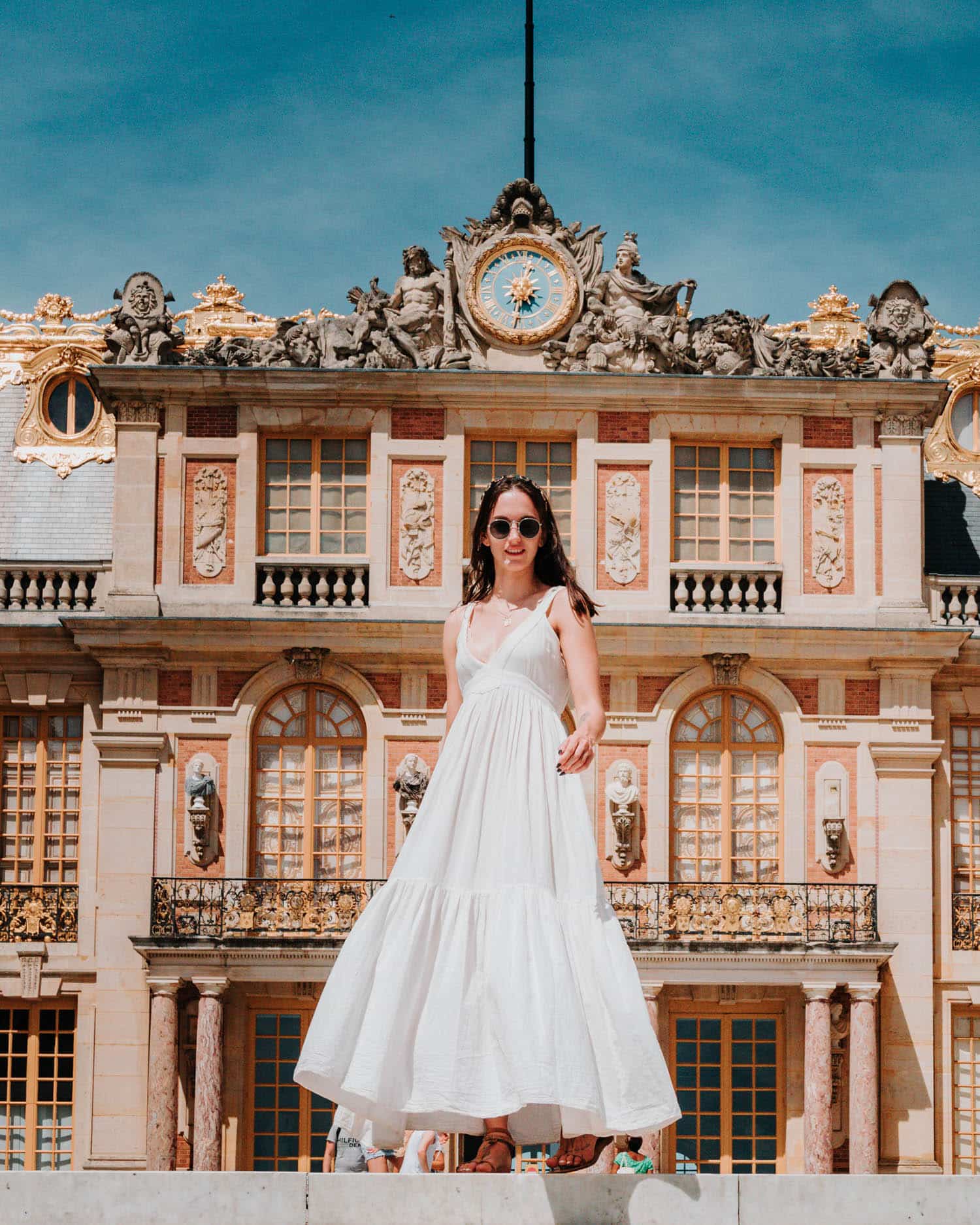 lauren in front of the palace of versailles