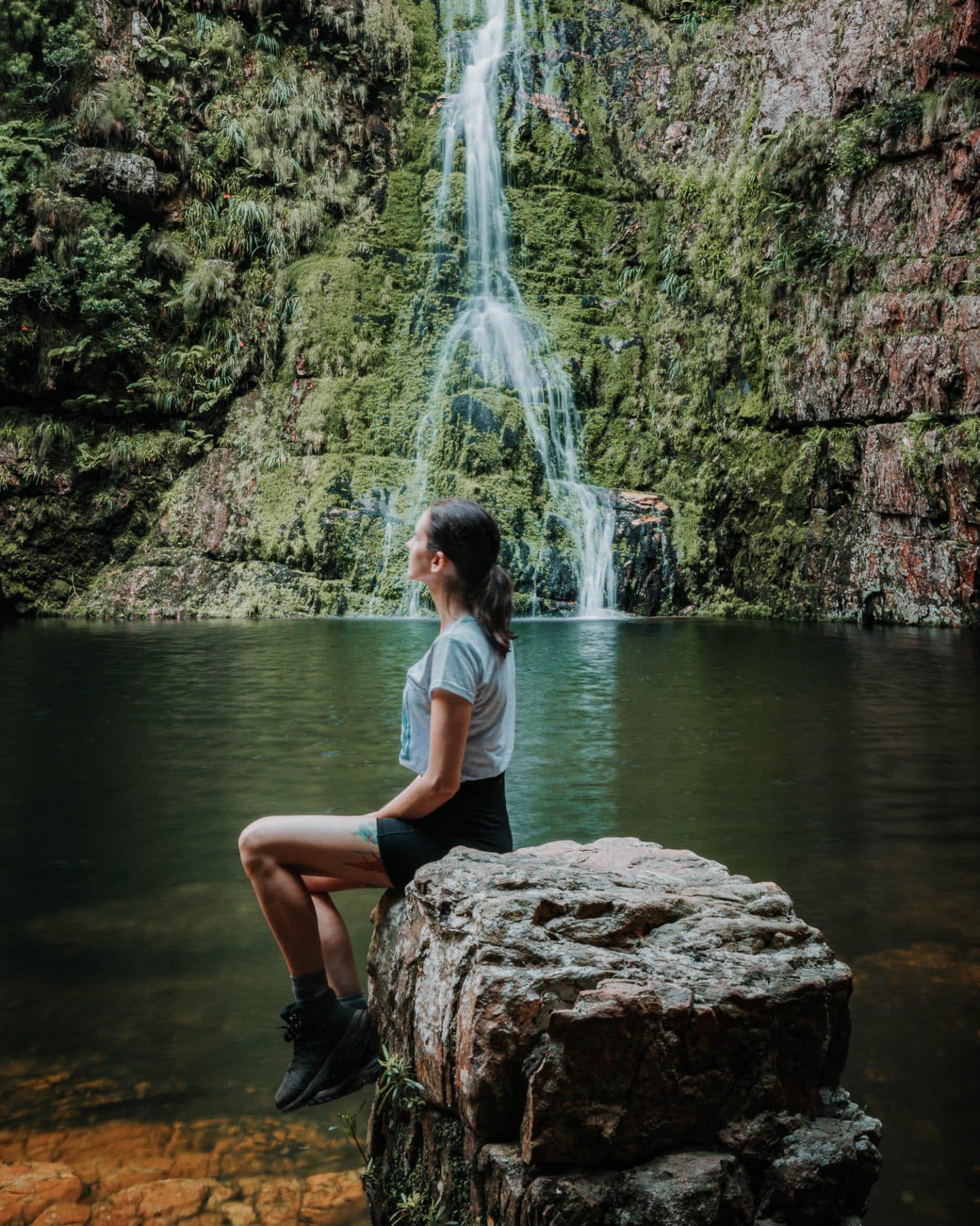 lauren sitting in front of the krom river waterfall near cape town