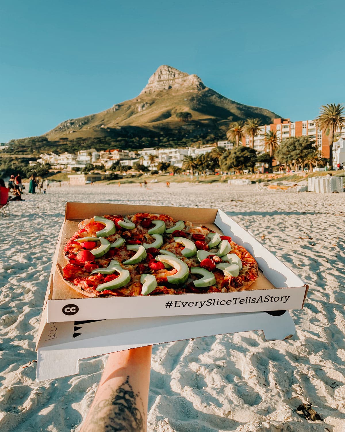 pizza on camps bay beach in cape town south africa